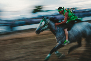 A competitor races in an Indian Relay Race during the Northwest Montana Fair and Rodeo.