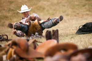 A cowboy practices before his ride.