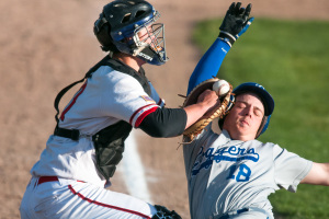 Kalispell Lakers catcher Brendan Windauer tags out Loggers runner Micah Germany (18) at home to get the last out of the top of the fifth inning during the Lakers matchup against Libby at Griffin Field in Kalispell, Mont.